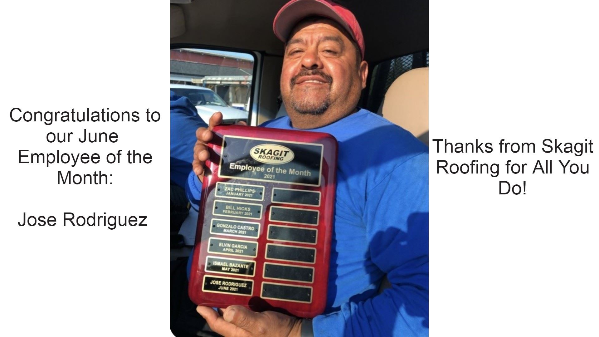 Skagit roofing employee holding up Employee of the Month award